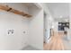 Laundry hookups and a wooden shelf is featured in this laundry area located in the partially finished basement at 4405 Gardenia St, Golden, CO 80403