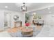 Inviting living area with hardwood flooring, an open layout, and a smooth transition to the dining space at 4405 Gardenia St, Golden, CO 80403
