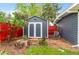 View of a well-maintained shed with double doors, situated in the backyard, providing extra storage at 4405 Gardenia St, Golden, CO 80403