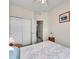 Bedroom featuring a large closet, ceiling fan, and side tables for lamps and personal items at 9085 E Phillips Dr, Centennial, CO 80112