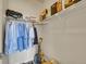 Walk-in closet with ample hanging space and shelves for shoes, personal items and cleaning supplies at 9085 E Phillips Dr, Centennial, CO 80112