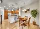 Eat-in kitchen boasts wood cabinetry, stainless appliances, granite countertops at 9085 E Phillips Dr, Centennial, CO 80112