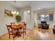 Open-concept dining space with ample natural light and wood flooring at 9085 E Phillips Dr, Centennial, CO 80112