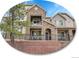 Beautiful multi-level home with stone accents, balconies, and well-maintained landscaping at 9085 E Phillips Dr, Centennial, CO 80112