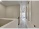Long hallway with neutral walls, carpeted flooring, recessed lighting, and decorative wall niches at 9085 E Phillips Dr, Centennial, CO 80112