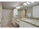 Bright bathroom featuring double vanities with granite countertops and a shower-over-tub at 2182 Eagle Ave, Superior, CO 80027