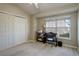 Cozy bedroom with natural light, fan, and closet at 2182 Eagle Ave, Superior, CO 80027