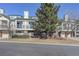 Attractive multi-story brick and siding building, complete with balconies and mature trees in front at 2182 Eagle Ave, Superior, CO 80027