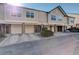 Exterior view of a townhome with driveways leading to garages and green landscaping at 2182 Eagle Ave, Superior, CO 80027