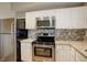 Kitchen with granite countertops, stainless steel appliances and a decorative backsplash at 2182 Eagle Ave, Superior, CO 80027