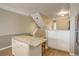 Kitchen island with granite countertop and white cabinets at 2182 Eagle Ave, Superior, CO 80027