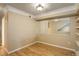 Bright living room features wood floors, neutral walls, and large mirror at 2182 Eagle Ave, Superior, CO 80027