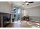 Living room featuring wood flooring, a fireplace, and a balcony with natural light at 2182 Eagle Ave, Superior, CO 80027