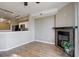 Open concept living room featuring wood flooring, a fireplace, and open access to the kitchen at 2182 Eagle Ave, Superior, CO 80027