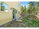 Backyard with wooden steps leading to the entrance at 6252 King Dr, Evergreen, CO 80439