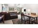 Finished basement with a brown sofa, dining table, and carpet at 6252 King Dr, Evergreen, CO 80439