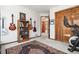 Bedroom featuring exercise equipment, a bookshelf and access to ensuite bathroom at 6252 King Dr, Evergreen, CO 80439
