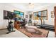 A bright bedroom with a ceiling fan, a desk, and a treadmill at 6252 King Dr, Evergreen, CO 80439