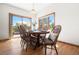 A dining room with a wood table, chairs, and a sliding door to the deck at 6252 King Dr, Evergreen, CO 80439