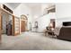 Grand foyer with high ceilings, staircase, and elegant furnishings at 6252 King Dr, Evergreen, CO 80439