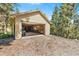 Spacious garage with an open door, revealing ample storage space and a vehicle inside at 6252 King Dr, Evergreen, CO 80439