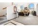 Bright living room featuring high ceilings, arched windows, and a cozy fireplace at 6252 King Dr, Evergreen, CO 80439