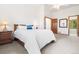 Well-lit main bedroom with ensuite bathroom access, neutral decor and plush carpet at 6252 King Dr, Evergreen, CO 80439