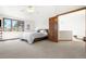 Bright main bedroom features vaulted ceilings, ceiling fan, and plush carpet at 6252 King Dr, Evergreen, CO 80439