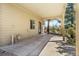 Covered patio with door and windows, and access to an outdoor area surrounded by lush greenery at 6252 King Dr, Evergreen, CO 80439