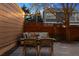 Cozy backyard patio illuminated with string lights, offering a relaxed setting for outdoor dining and entertaining at 1913 Julian St, Denver, CO 80204