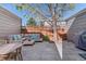 Inviting backyard patio with comfortable outdoor seating and a well-maintained paved surface, perfect for relaxing at 1913 Julian St, Denver, CO 80204