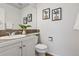 Cozy bathroom featuring a vanity with a tile countertop, a mirror, and tasteful decor at 1913 Julian St, Denver, CO 80204