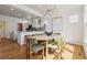 Open dining area with a modern chandelier and views of kitchen at 1913 Julian St, Denver, CO 80204