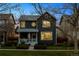 Charming two-story home with well-manicured lawn and landscaping, showcasing curb appeal in a residential setting at 1913 Julian St, Denver, CO 80204