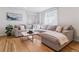 Bright living room featuring hardwood floors, a comfortable sectional, and a modern coffee table at 1913 Julian St, Denver, CO 80204