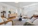 Bright and open living room featuring a fireplace, hardwood floors, and natural light at 1913 Julian St, Denver, CO 80204