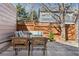Outdoor patio with a dining set, comfortable seating, and a privacy fence at 1913 Julian St, Denver, CO 80204