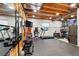 A finished basement designed as a gym, complete with mirrors, weights, and gym equipment at 15506 Short Line Ct, Monument, CO 80132