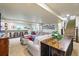 Open basement area with a bar, seating, and carpeted stairs leading to the upper level at 15506 Short Line Ct, Monument, CO 80132