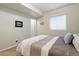 Bedroom with neutral walls and carpet with a large window providing natural light at 15506 Short Line Ct, Monument, CO 80132