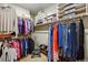 Walk-in closet with shelving and storage racks to keep your wardrobe organized at 15506 Short Line Ct, Monument, CO 80132