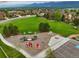 Overhead shot of neighborhood park featuring playground, grassy area, and parking at 15506 Short Line Ct, Monument, CO 80132