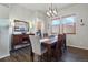 Elegant dining room with wood table, and stylish chandelier lighting for formal meals at 15506 Short Line Ct, Monument, CO 80132