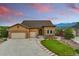 Charming single-Gathering home featuring a well-manicured lawn, three-car garage, and stunning mountain views at 15506 Short Line Ct, Monument, CO 80132