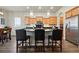 Stylish kitchen area featuring pendant lighting, a breakfast bar, stainless steel appliances, and lots of cabinets at 15506 Short Line Ct, Monument, CO 80132