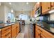Well-equipped kitchen boasting stainless steel appliances, a breakfast bar, and gorgeous mountain views at 15506 Short Line Ct, Monument, CO 80132