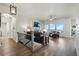 Cozy Living Room features a fireplace, large windows and lovely wood floors at 15506 Short Line Ct, Monument, CO 80132