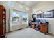 Bright home office with large windows offering neighborhood views and ample natural light at 15506 Short Line Ct, Monument, CO 80132