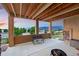 Spacious covered patio with a bench and mountain views, ideal for relaxing outdoors at 15506 Short Line Ct, Monument, CO 80132