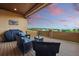 Covered patio with seating area and mountain views, perfect for outdoor relaxation and entertaining at 15506 Short Line Ct, Monument, CO 80132